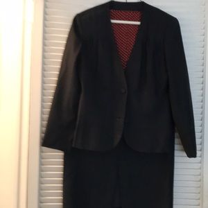 Hand tailored navy wool suit lined with red silk